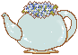 An image of a blue teapot filled with blue flowers.