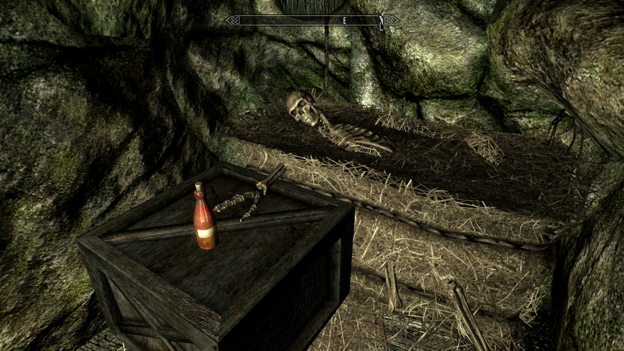 a Skyrim screenshot of a skeleton stuck in a bale of hay, reaching out for a bottle of mead.